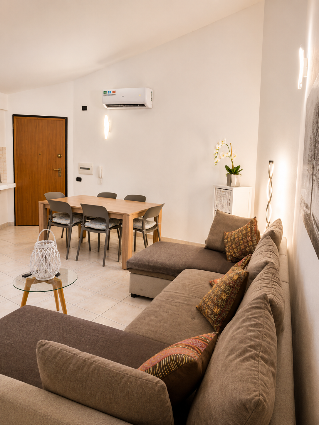 Open-plan room from the sofa, showing the dining area and private entrance