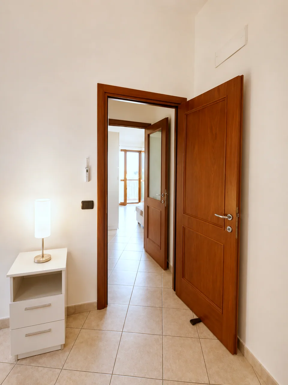 Hallway with private entrance door leading to the second bedroom